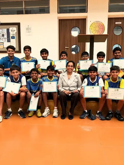 The camp concludes with a group of proud players holding their certificates alongside a faculty member. This image signifies the successful completion of our intensive High Performance Training Camp.