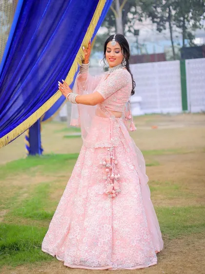 A full-length shot showing the bride's graceful movement during our outdoor shoot.