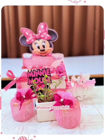 A sweet and simple Minnie Mouse themed hamper with two treat jars and a small planter.