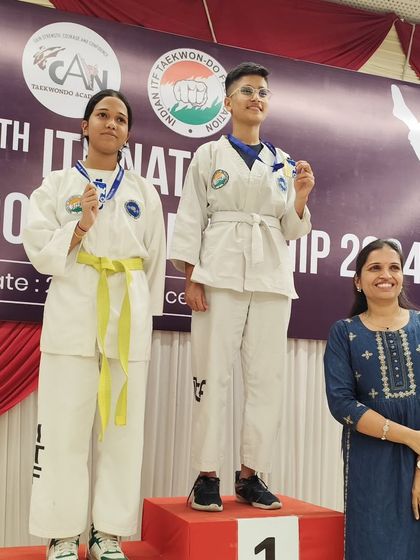 A proud parent looks on as our students receive their awards. We value the support of our students' families.