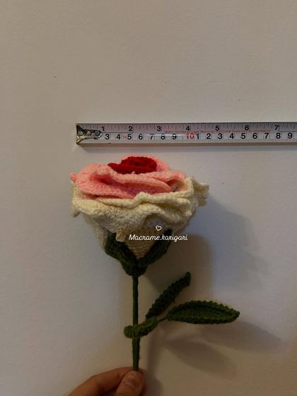 A close-up measurement of another one of our dual-toned crochet roses. The craftsmanship ensures each petal has a delicate, realistic curve.
