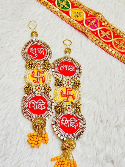 This multi-tiered hanging includes Shubh, Labh, Riddhi, and Siddhi. It's a complete set to invite all-around prosperity and blessings into your home.