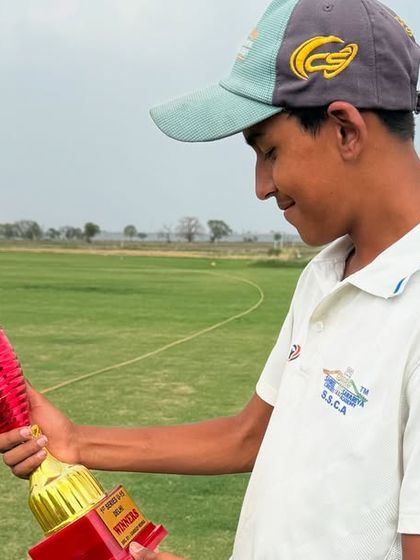 Our player admiring his championship trophy. This is the result of countless hours of practice and dedication.