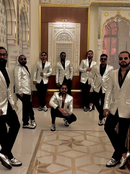 Ready to make the beats drop. The crew looking sharp in silver and black, ready for a night of performance.