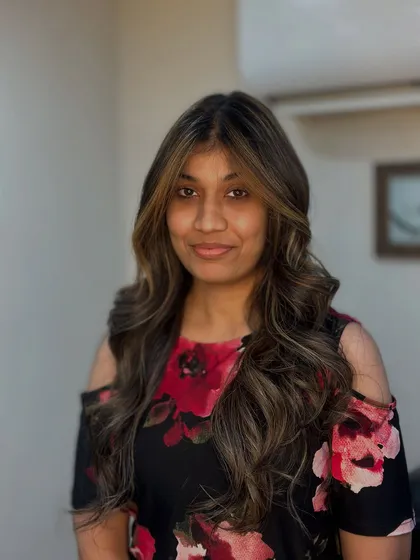 A happy client with her fresh balayage and soft waves. The face framing highlights and layers give her a radiant and stylish finish.