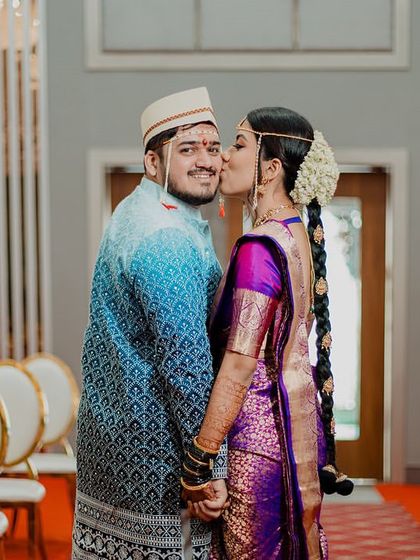 A sweet kiss on the cheek in the empty ceremony hall. We love to steal the couple away for a few quiet portraits that reflect their love.