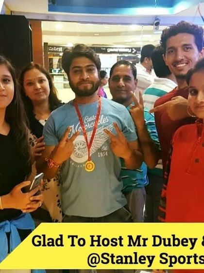 Mr. Dubey and his family celebrating a great day out. Group activities like archery are a wonderful way to bond and create shared memories.