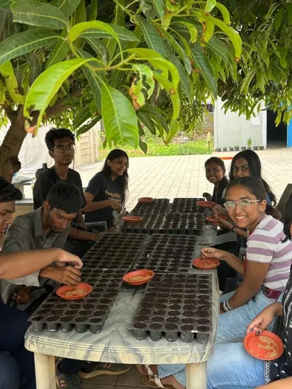 Our workshops are all about getting your hands dirty. Here, we are guiding students through the process of sowing seeds, the very first step in their journey to becoming urban farmers.