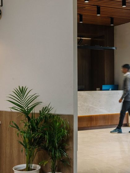 A view of the reception area, showing the flow of movement and the clean, modern design of the space.