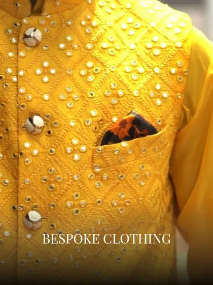 A close-up view of the vibrant mirror and threadwork on a festive yellow waistcoat. This level of detail is central to my craft, bringing texture and life to each garment.