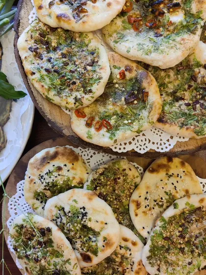 Our handmade assorted kulchas are a testament to our love for authentic Indian breads. This platter includes a variety of toppings like fresh herbs, spices, and seeds, perfect to pair with any of our North Indian curries.
