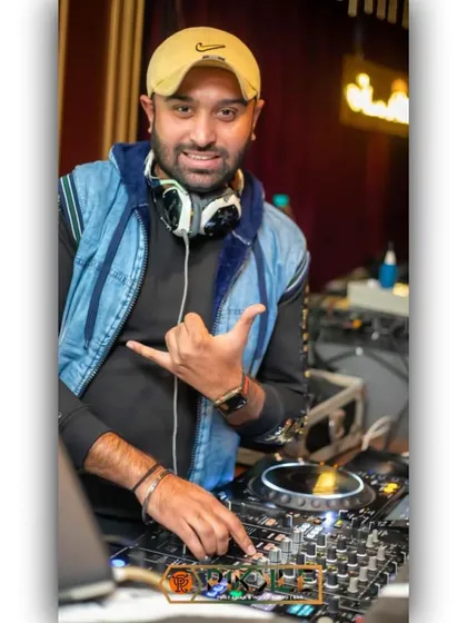A relaxed and confident pose behind the decks. Years of experience have taught me how to stay comfortable and in control in any party environment.