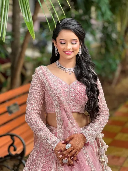 Another lovely portrait of the engagement bride, her hands adorned with mehndi and a statement diamond ring.