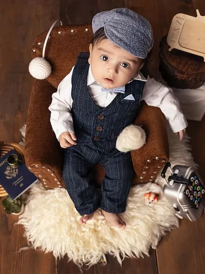 An overhead shot capturing this little traveler's curious gaze. I love experimenting with different angles to create a diverse and interesting gallery for parents.