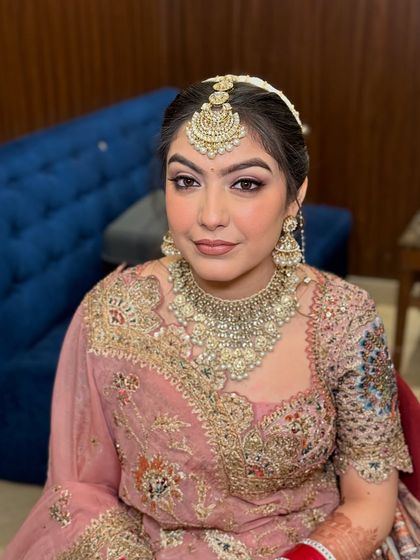 A beautiful portrait of the bride. The makeup is designed to be timeless, ensuring her wedding photos are cherished for years to come.