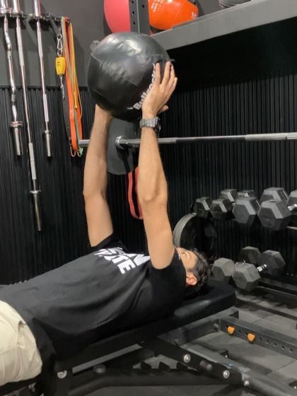 A medicine ball chest pass from a bench. This is an excellent upper body plyometric drill for developing explosive pushing power, similar to the motion of a powerful throw.