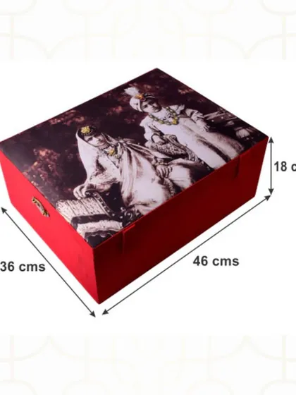 This personalized trousseau box features a vintage portrait of a royal couple, adding a touch of old-world charm. The dimensions shown highlight its generous size, perfect for storing bridal outfits.
