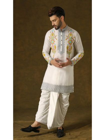 The 'Narayan Nirvana' set, featuring an ivory organza kurta with vibrant pops of color and silver embroidery, paired with a traditional dhoti for a timeless look.