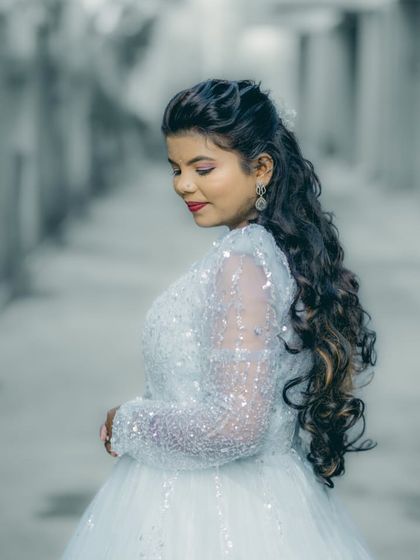 Our beautiful client slaying in her light blue princess gown. The sequined bodice and full tulle skirt create a magical look.