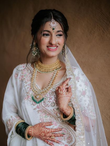 A radiant close up of the bride. Her skin looks luminous, and her smile is infectious.