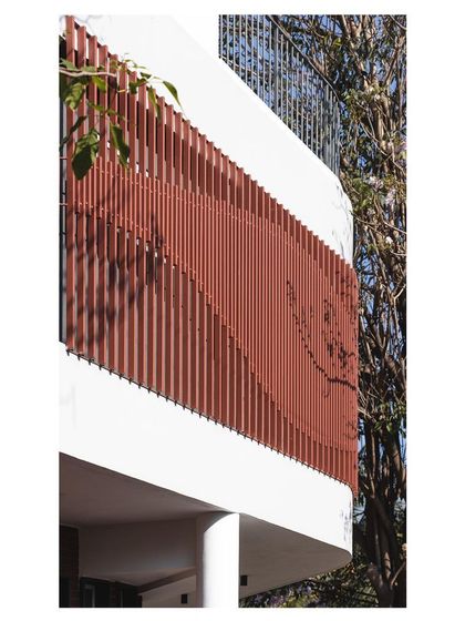 A detailed shot of the parametric facade, showing how the vertical elements are arranged to create a flowing, organic pattern across the building's exterior.