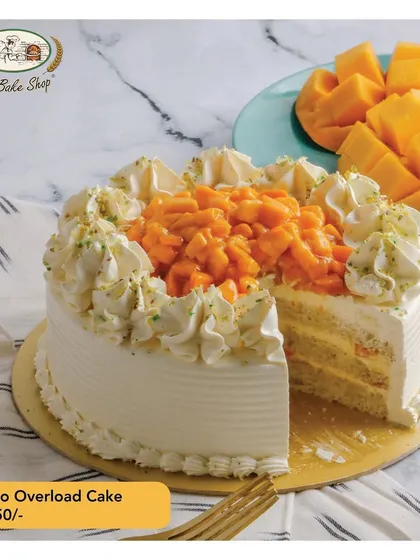 Our Mango Overload Cake is a true celebration of the season. Made with fresh, juicy mangoes and light vanilla cream, each slice offers a burst of pure summer flavor.