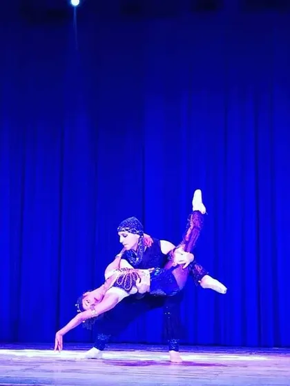Performing a lift like this on stage is a powerful feeling that requires immense strength and coordination from both partners. This is an example of the advanced pas de deux work that is part of a professional ballet career.