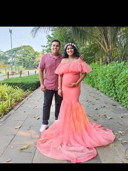 A lovely couple portrait in a park setting, featuring the peach mermaid gown. It shows how beautifully this style works for outdoor shoots that include your partner.