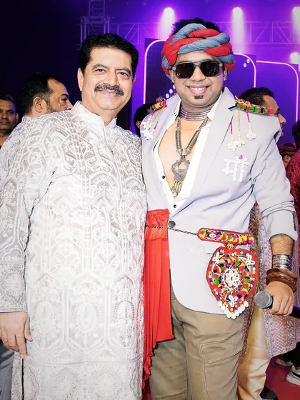 Sharing a moment with a respected guest at a Navratri event. I ensure that all VIPs and special guests feel welcomed and honored.