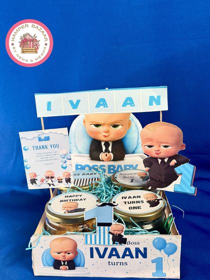 Here's another take on the Boss Baby theme for Ivaan's first birthday, featuring multiple character cutouts and a personalized name banner.