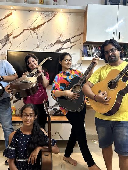 Our adult students and I, rocking out with a mix of acoustic and electric guitars. The energy was fantastic.