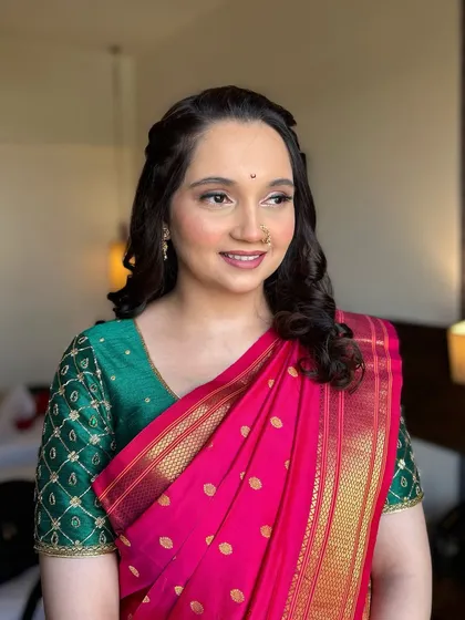 A classic and timeless look for a client in a traditional saree. The makeup is minimal and clean, with a focus on radiant skin and a simple bindi.