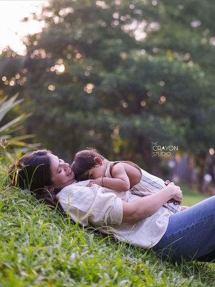 A quiet cuddle in the middle of a playful afternoon. This tender moment between a mother and her child, resting together on the grass, is a beautiful memory of peace and affection that I was honored to capture.