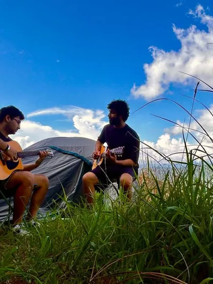Guests enjoy a music session in the open, camping amidst the stunning Himalayan scenery at Renz Himalayan Retreat. We host unique events like music retreats that blend creativity with nature.