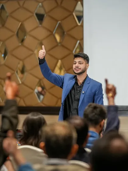 Getting the audience involved is a key part of my show. Here, I'm asking for a volunteer during a corporate event in Mumbai, ensuring the magic is an interactive and shared experience.