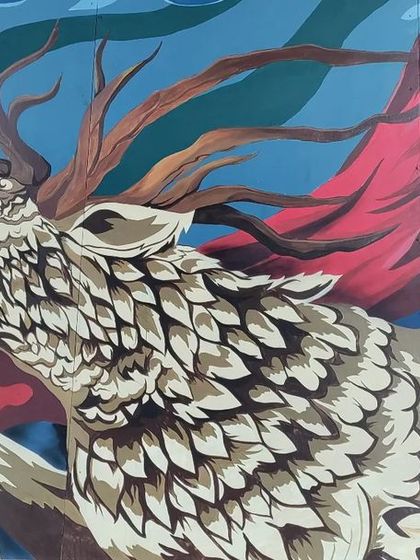 The right side of the Mysore mural, featuring a howling deer with flowing red fabric. This character complements the tiger, representing a different aspect of nature's spirit within the same epic composition.