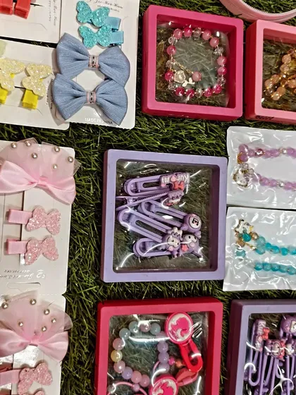 This picture shows how some of the smaller accessories like hair clips and bracelets are packaged. The small display boxes make them easy to gift and look very presentable.