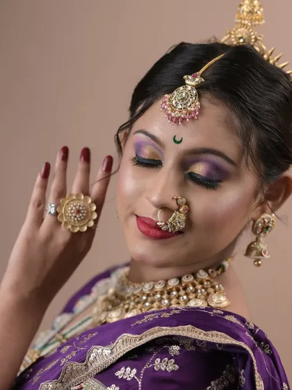 A close-up of the beautiful eye makeup and traditional jewelry from a student's final project.