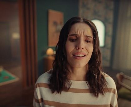 A close-up of the main character from the Urban Company ad. Her simple striped shirt and stressed expression tell the story of a tired mom who needs a break.