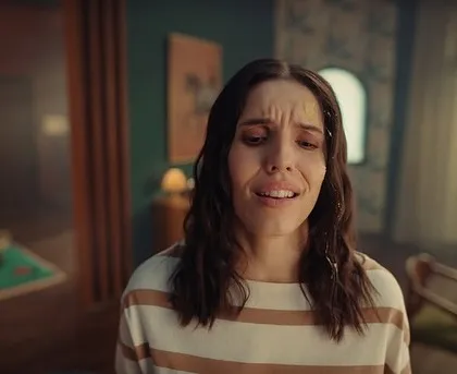 A close-up of the main character from the Urban Company ad. Her simple striped shirt and stressed expression tell the story of a tired mom who needs a break.