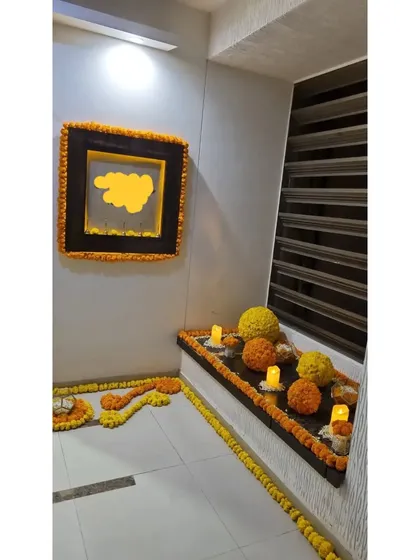 We find creative ways to decorate every nook. This window seating area was transformed with a bed of marigold petals, marigold balls, and candles, adding a festive touch to an often-overlooked space.