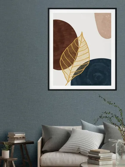 This single framed print showcases a beautiful golden leaf against a backdrop of abstract shapes in deep blue and brown. The elegant design is perfect for adding a touch of sophisticated nature to your decor.