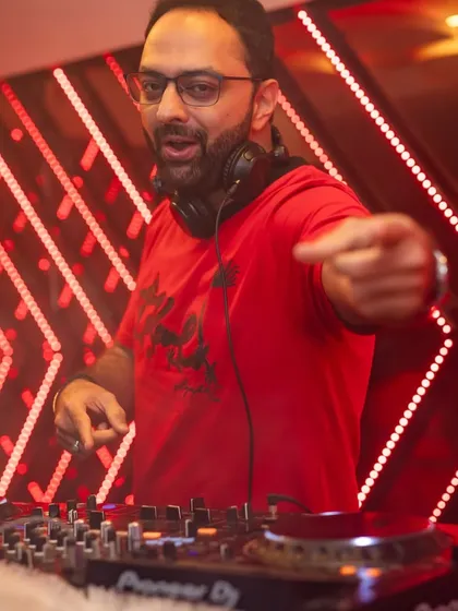 Right in the middle of the action at Nolimmits Lounge. I love connecting with the crowd, pointing to the people who are really feeling the music. It's all about creating that shared party experience.