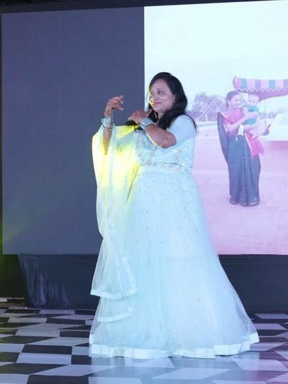 A graceful solo performance by one of the senior family members. Her expressions and elegance are a joy to watch.