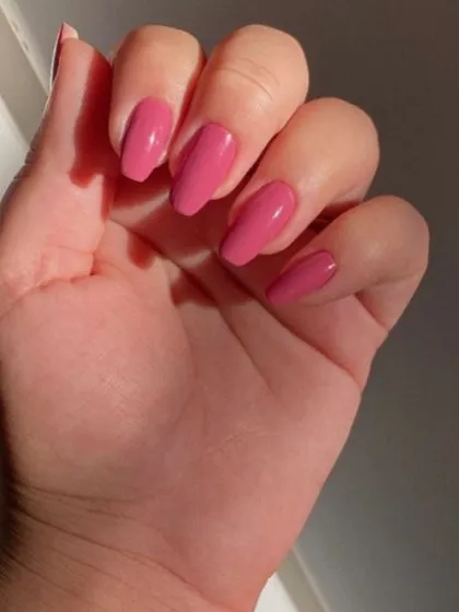 A bright, Barbie-pink on coffin-shaped nails. This color is so fun and perfect for summer.