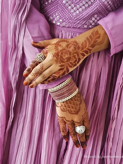 A close-up of the party henna, highlighting the delicate rose details and the rich color.