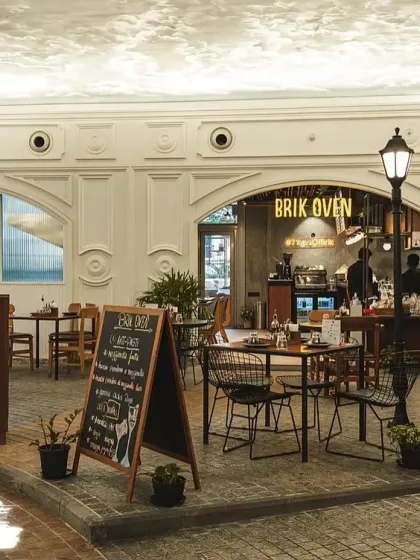 Our Palace Road location, designed to feel like a European street with its unique facade, cobblestone-style flooring, and lampposts.