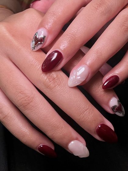 The full set, showing how the different designs on each nail come together to create a cohesive and artistic look.