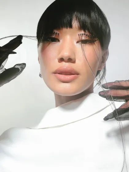 Turning every blink into an artistic statement. This look features dramatic, thread-like lashes for a high-fashion, conceptual shoot.