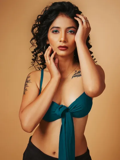 A portrait that combines a focus on the model's face with a clear view of the bikini top, showing both beauty and product.